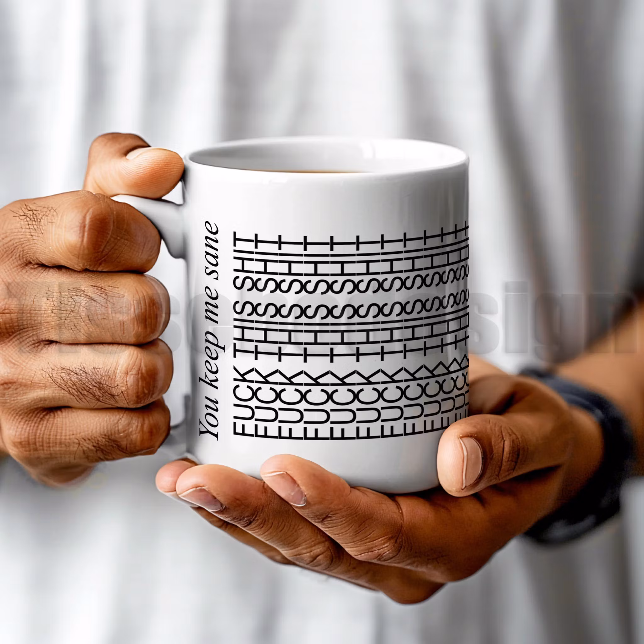 Mugg med texten FCK THIS SHIT i upprepat grafiskt mönster och orden You keep me sane på sidan – keramikmugg 330 ml.