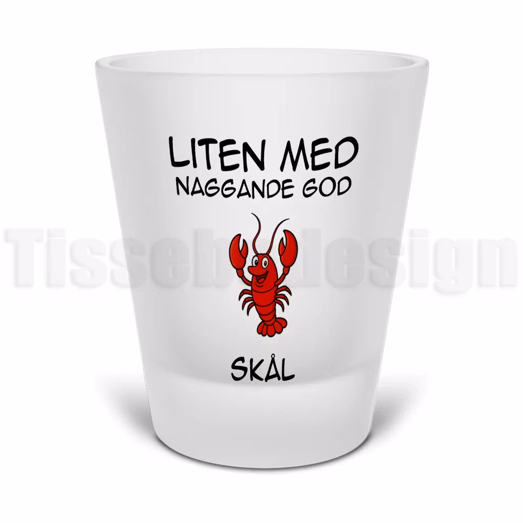 Snapsglas i frostat glas med kräfta och tryckt text Liten med naggande god samt Skål – humoristiskt festmotiv