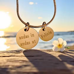 Personligt graverat andas in andas ut i guldfärg