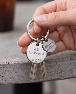 Nyckelring ett helvete i taget med personlig tag
