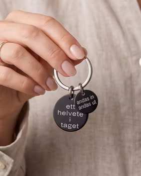 Nyckelring ett helvete i taget med personlig tag