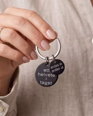 Nyckelring ett helvete i taget med personlig tag