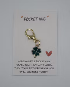 Pocket hug, four leaf clover charm