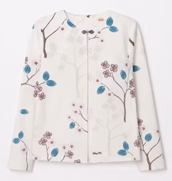 Damjacka cremevit med blommigt mönster