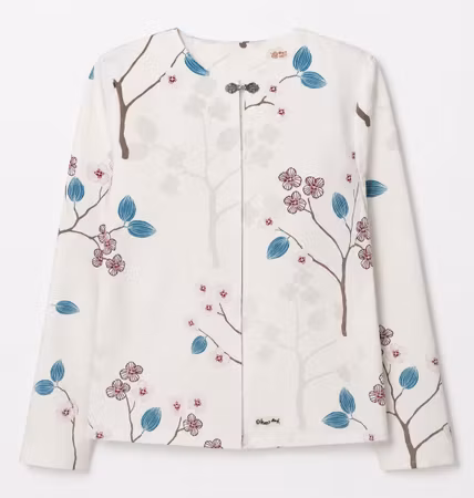Damjacka cremevit med blommigt mönster