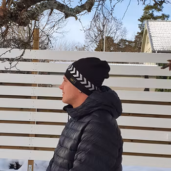 Reflexmössa på rad pil storlek 48-64