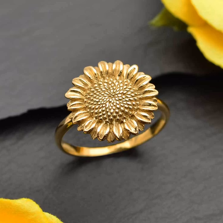 Bronsring i form av en solros.