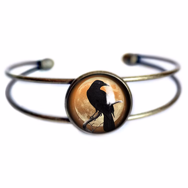 Manschettarmband – Kråkfågel, orange måne