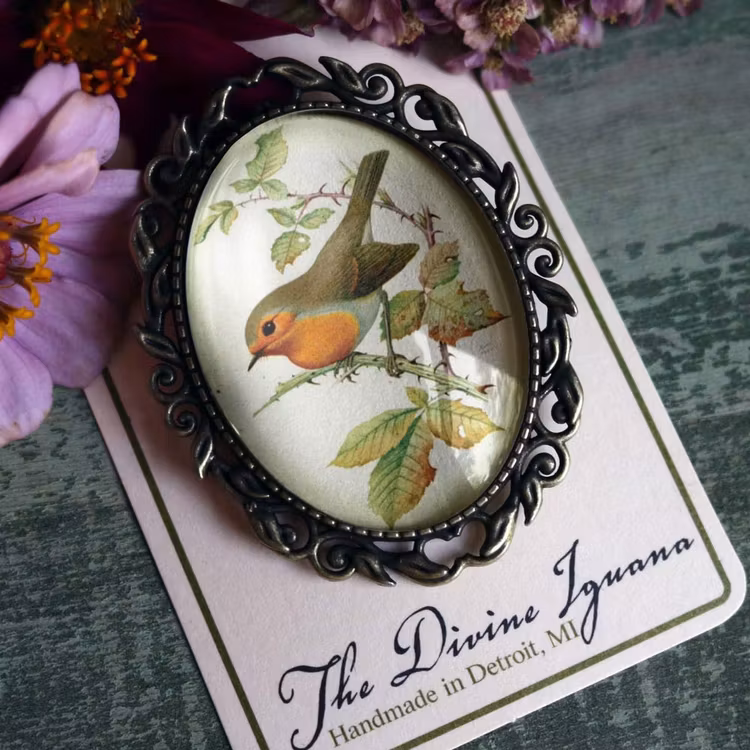 Brosch, stor oval – Rödhake