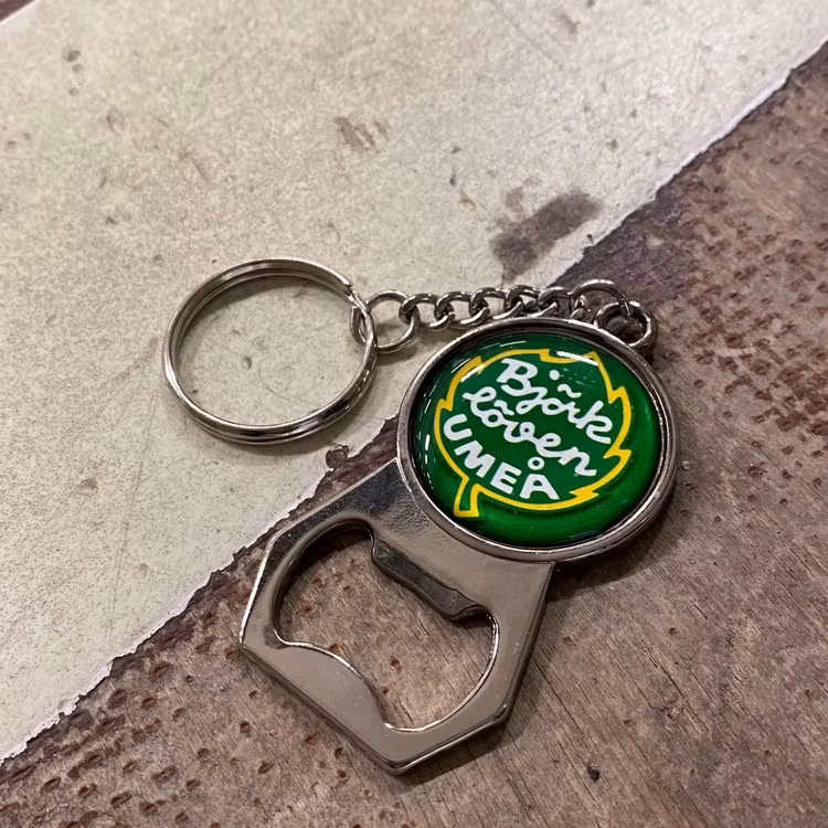 NYCKELRING MED KAPSYLÖPPNARE