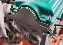 Täckplåt bakom kamaxel B230