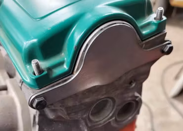 Täckplåt bakom kamaxel B230