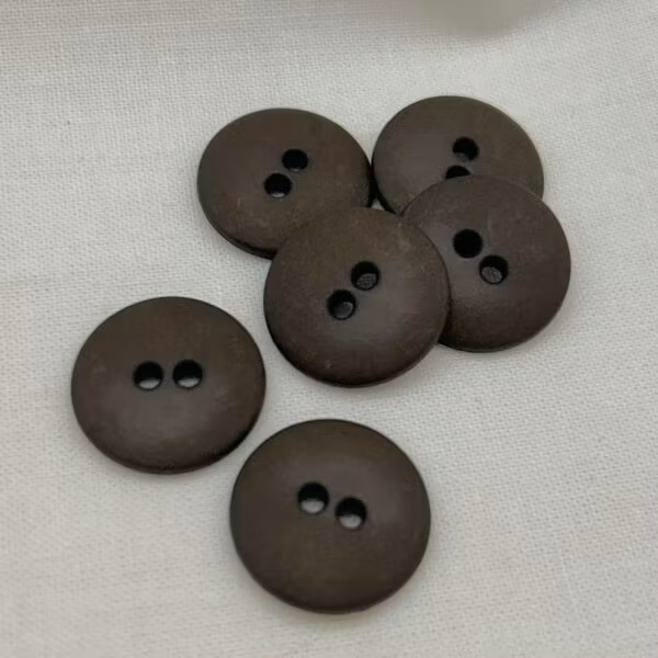 Knapp – Nancy Brun – 18 mm ( K190888)