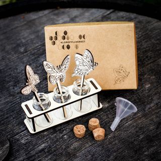 Stickling/eteriska oljor station fjärilar