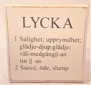 Liten låda med text "Lycka"