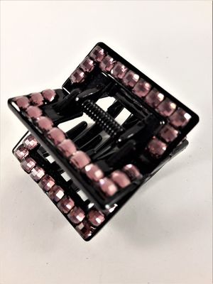 Svart hårklämma med rosa detaljer