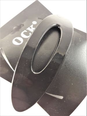 Svart, ovalt, blankt hårspänne