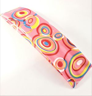 Hårband i glada färger och mönster, elastiskt, rosa bottenfärg