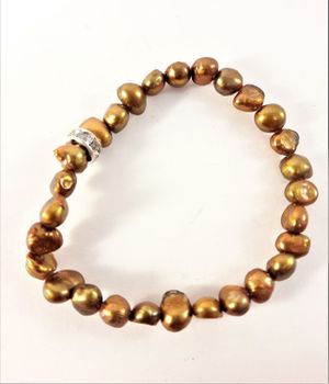 Enkelt Armband med Små Guldfärgade Pärlor och Ring med Strass