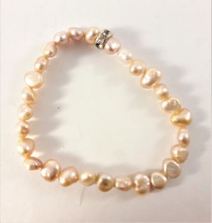 Enkelt Armband med Små Aprikosfärgade Pärlor och Ring med Strass