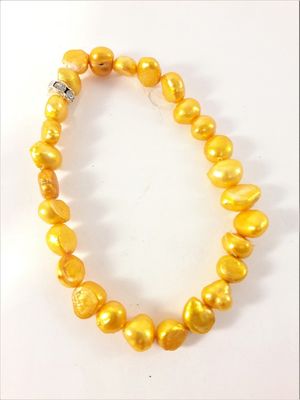 Enkelt Armband med Orange Pärlor och Ring med Strass
