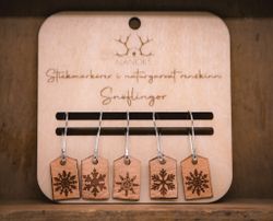 Stickmarkörer i renskinn, snöflingor