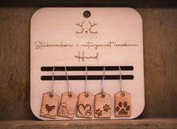 Stickmarkörer i renskinn, hund