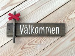 Välkommenskylt i trä ledkryss