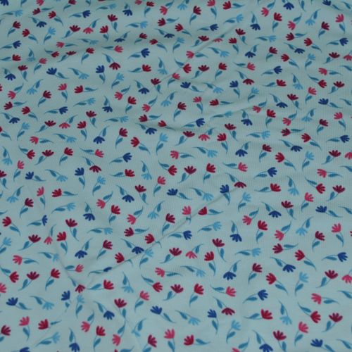 Trikåtyg ljusblå botten med söta små tulpaner