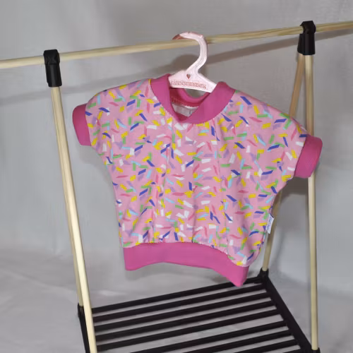 Dock - Rosa tröja med strössel stl 43-45 cm