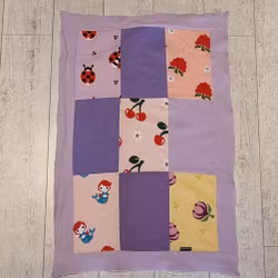 Lapptäcksfilt i trikå till baby