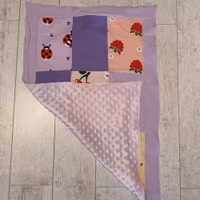 Lapptäcksfilt i trikå till baby