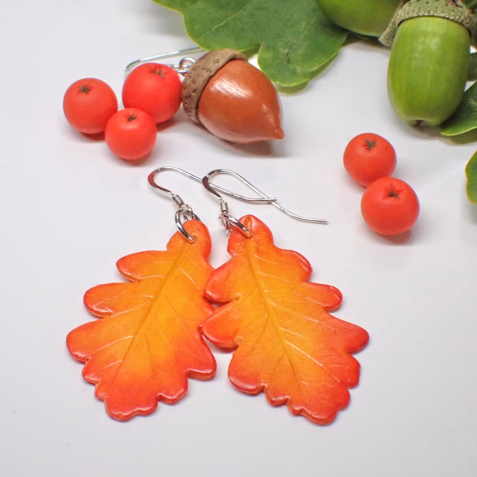 Eklöv örhängen 28 mm silver/guld