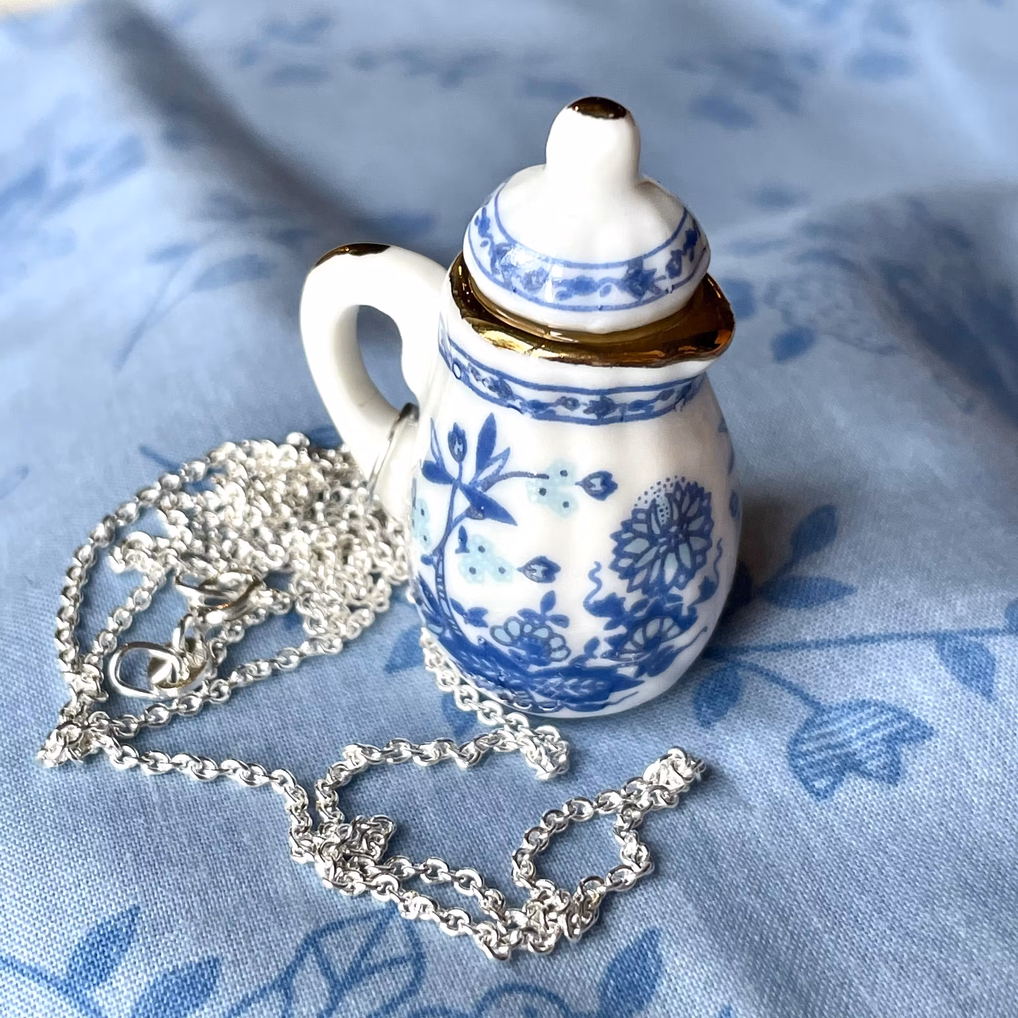 Kanna stor blå / rosa halsband silver / guld