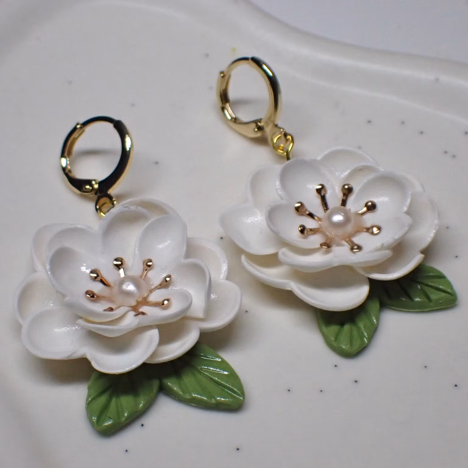 Magnolia vita guld/silver