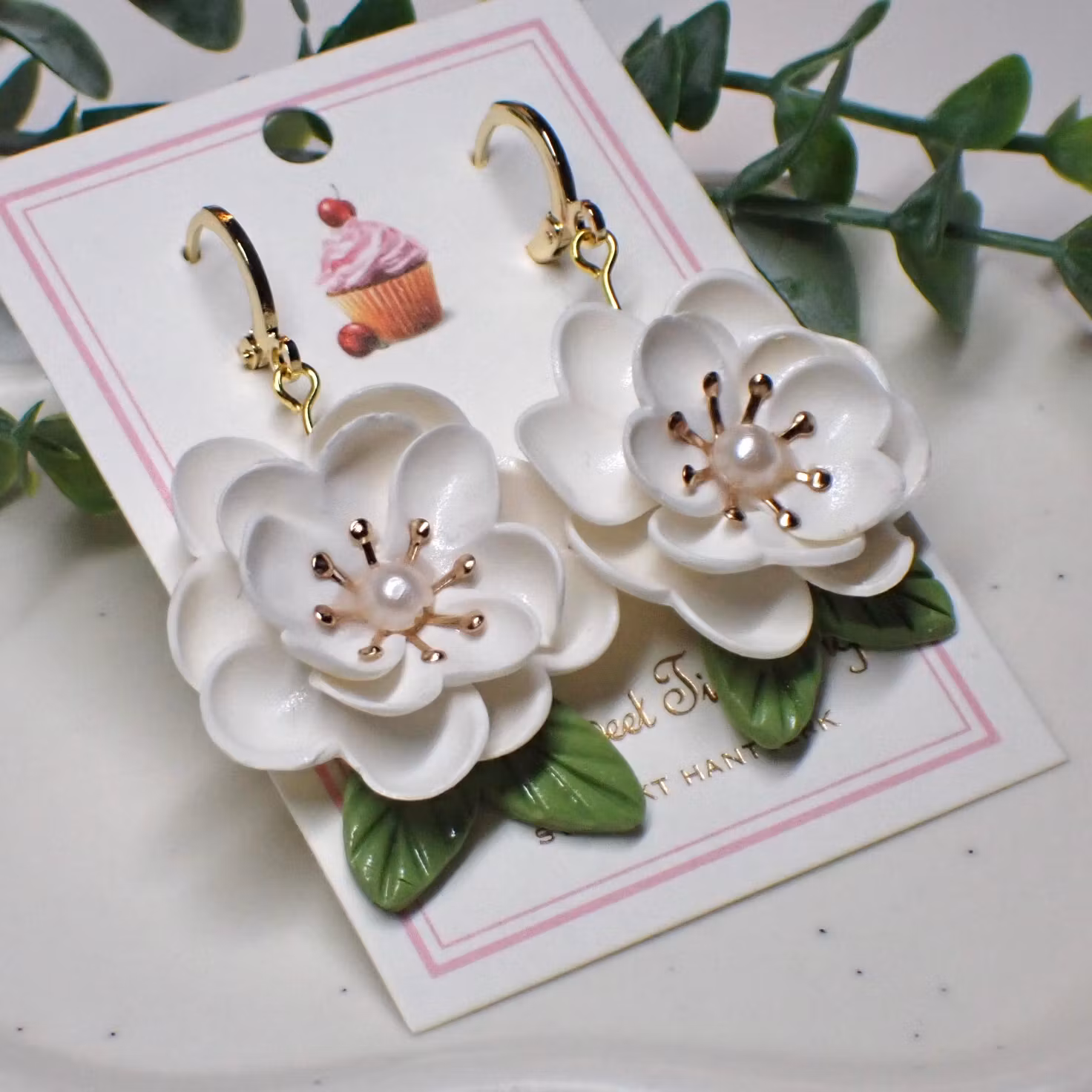 Magnolia vita guld/silver