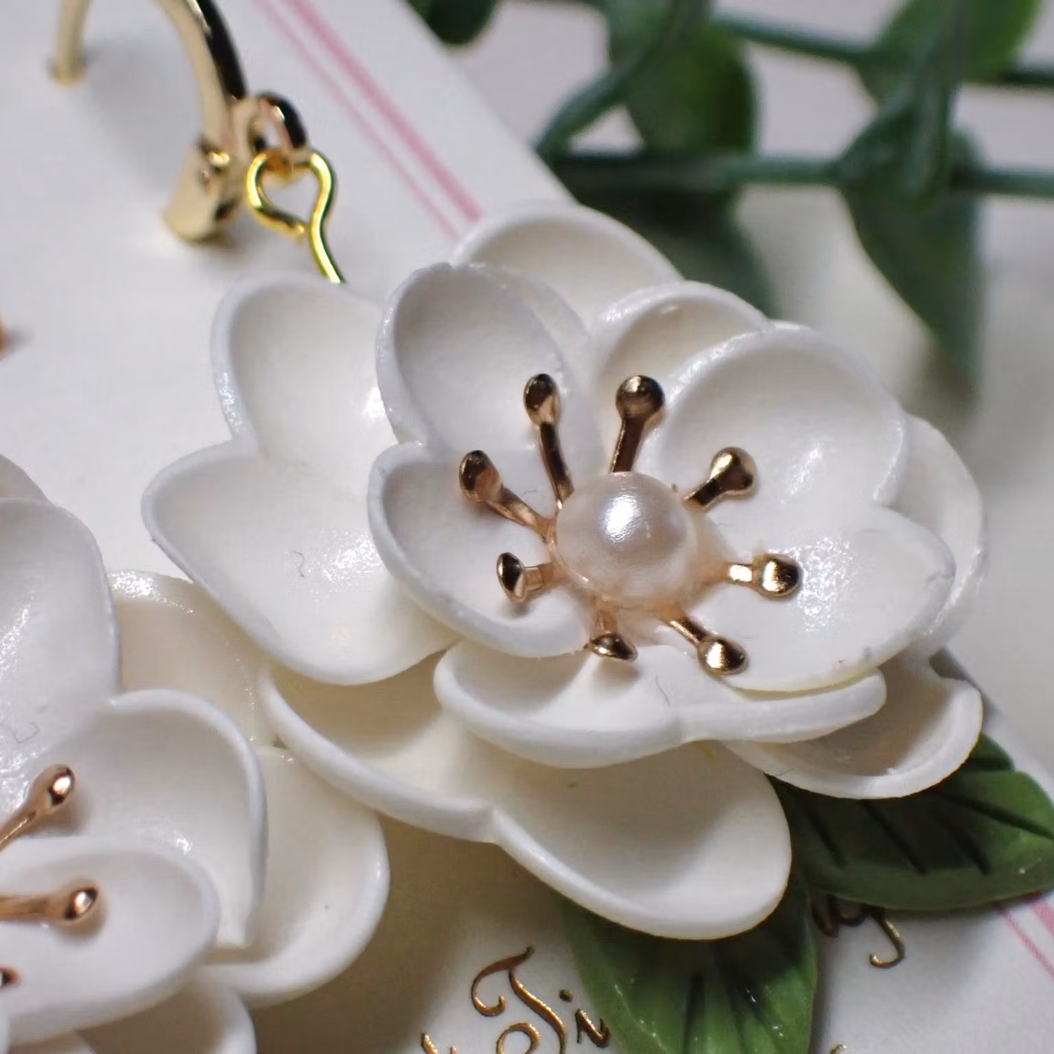 Magnolia vita guld/silver