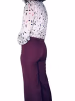 Blus med fjädrar i guld och silver