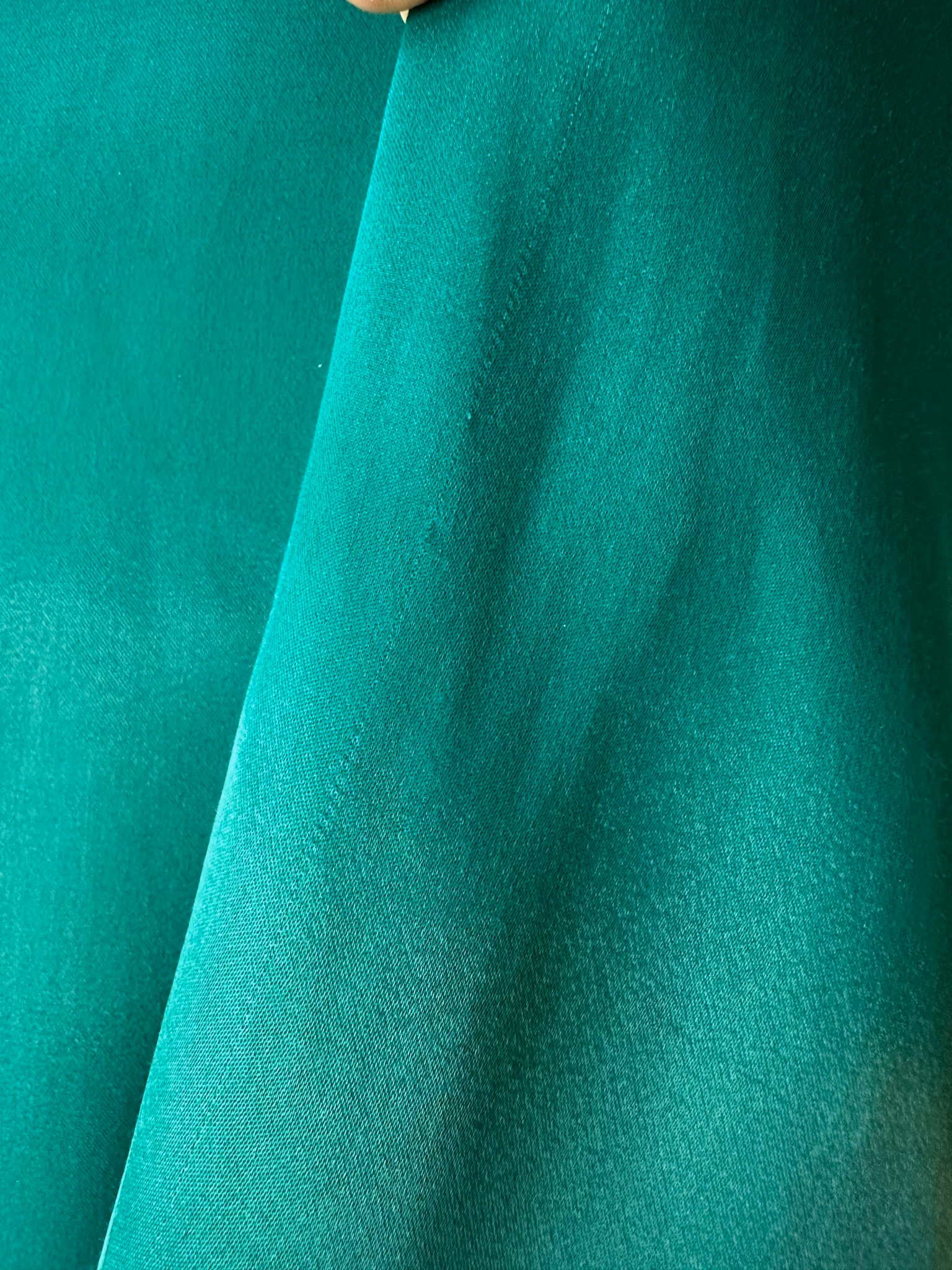 Grön kavaj med fjädrar