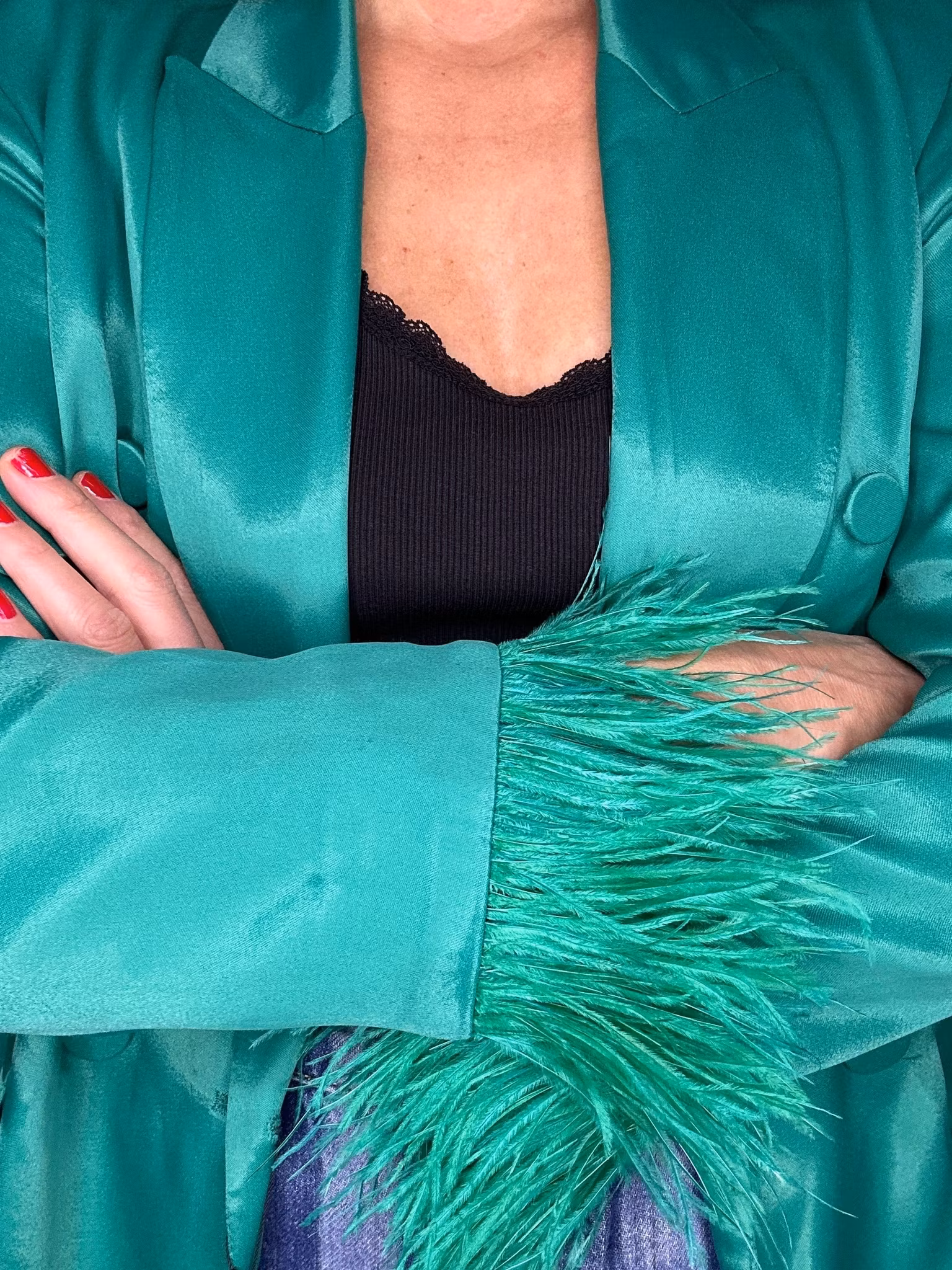 Grön kavaj med fjädrar