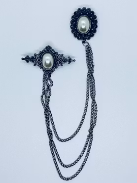 Dubbelbrosch med pärlor och kedjor