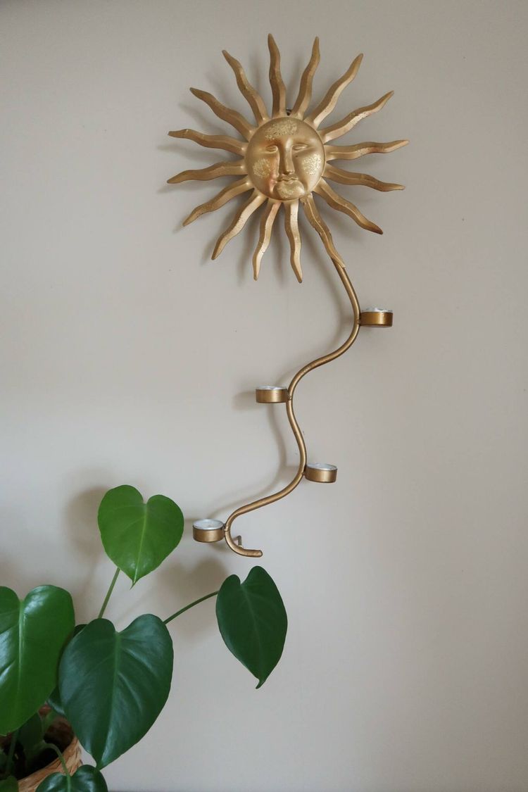 Sol väggljusstake
