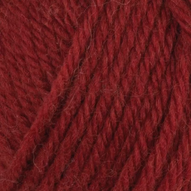 Närbild på Snorre Collection Nordwool, 50g, 161 Vinröd – garnets färg och struktur.