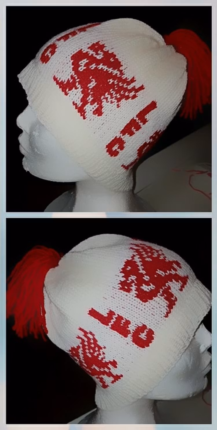 Mønster på luen : Hvit med rød birdie