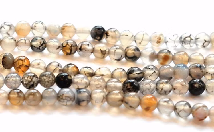 Agat ljusgråmelerad 4 mm, 1 sträng