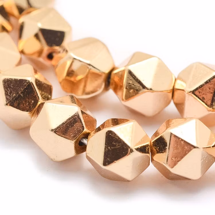 Ljust guldfärgad hematit 7-8 mm star cut, 10 st