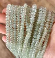 Facetterad abacus prehnit 6x4 mm, 1 sträng