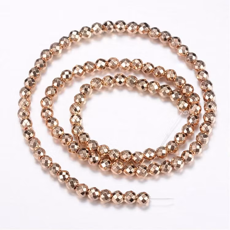 Ljust guldfärgad hematit facetterade 8 mm, 1 sträng