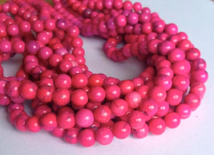 Howlite cerise 6 mm, 1 sträng