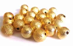 Guldfärgade stardust 8 mm, ca 50 st